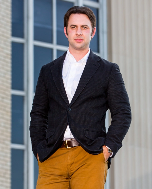 A photo of Garrett Ballengee in front of a window.